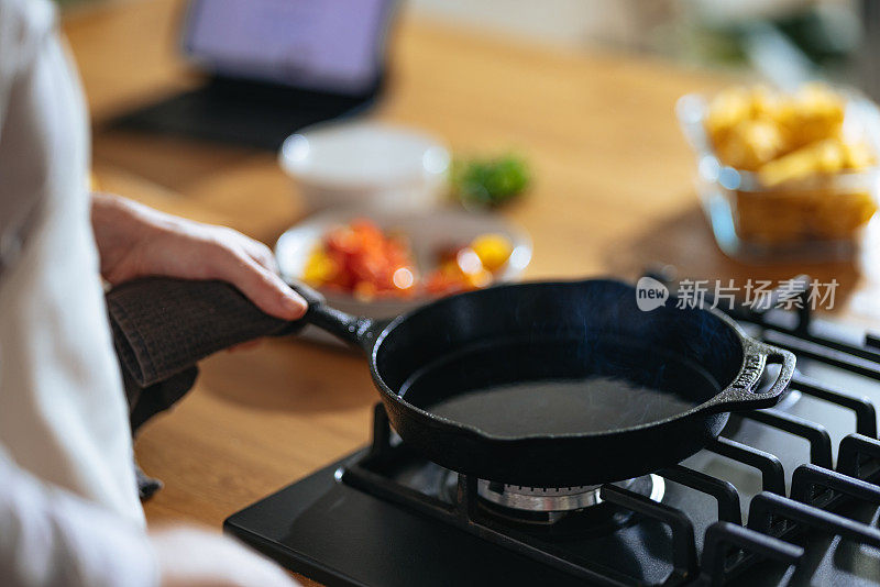 Close Up Photo Of Manâs Hands Preparing Lunch In A Pan At Home